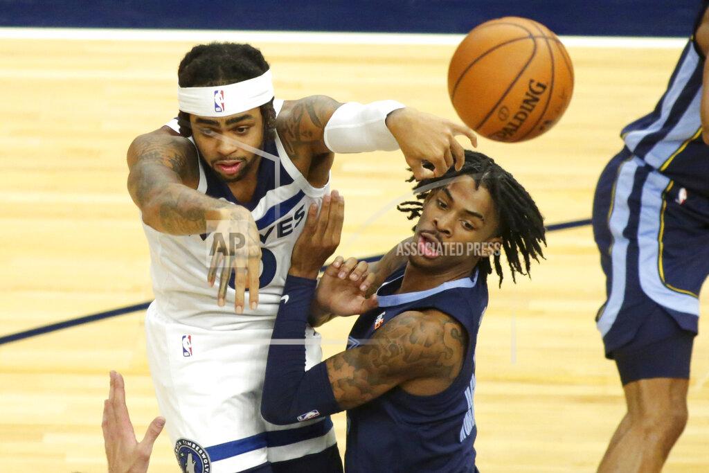 Andy Clayton-King Minnesota Timberwolves guard D'Angelo Russell (0) passes out of pressure from Memphis Grizzlies guard Ja Morant in the third quarter during an NBA preseason basketball game, Saturday, Dec. 12, 2020 in Minneapolis. (AP Photo/Andy Clayton- King)