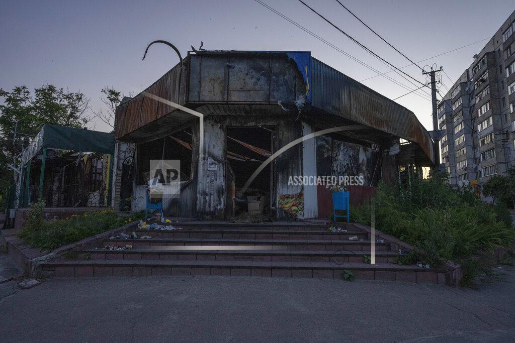 Nariman El-Mofty A damaged super market on Tsentralna which is still known as 'Lenin Street,' the most affected street from Russian aerial bombs according to witnesses, in Borodyanka, Kyiv region, Ukraine, Saturday, July 2, 2022. Ukrainians displaced in Borodyanka near the capital wonder what will happen to their war-damaged homes. Russian troops retreated from the area around Kyiv in late March. But authorities say they left behind 16,000 damaged residential buildings in the Bucha region where Borodyanka is located. (AP Photo/Nariman El-Mofty)
