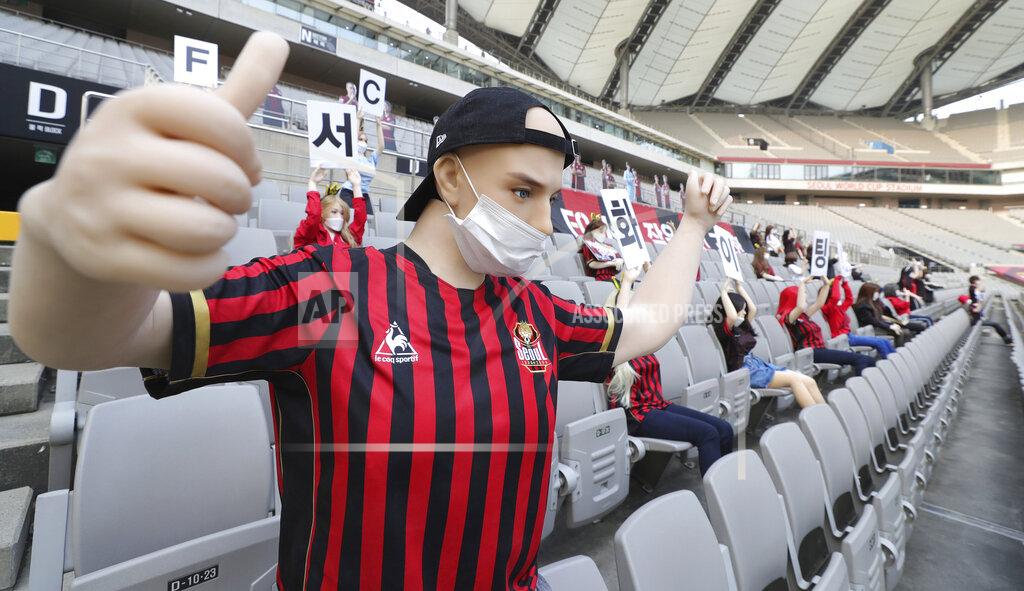 In this May 17, 2020 photo, cheering mannequins are installed at the empty spectators' seats before the start of a soccer match between FC Seoul and Gwangju FC at the Seoul World Cup Stadium in Seoul, South Korea. A South Korean professional soccer club has apologized after being accused of putting sex dolls in empty stands during a match Sunday in Seoul. In a statement, FC Seoul expressed "sincere remorse" over the controversy, but insisted that it used mannequins, not sex dolls, to mimic a home crowd during its 1-0 win over Gwangju FC at the Seoul World Cup stadium. (Ryu Young-suk/Yonhap via AP)