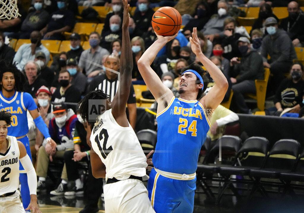 David Zalubowski UCLA guard Jaime Jaquez Jr. shoots over Colorado forward Jabari Walker during the first half of an NCAA college basketball game Saturday, Jan. 22, 2022, in Boulder, Colo. (AP Photo/David Zalubowski)