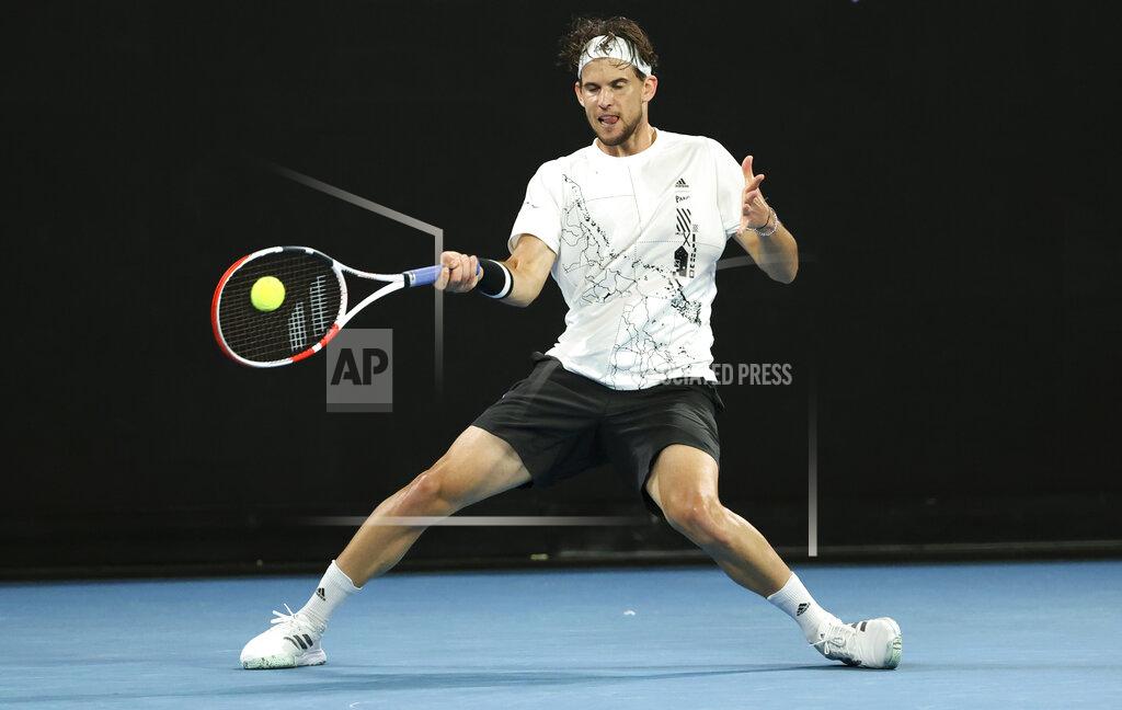 Hamish Blair Austria's Dominic Thiem plays a shot during his third round match against Australia's Nick Kyrgios at the Australian Open tennis championship in Melbourne, Australia, Friday, Feb. 12, 2021.(AP Photo/Hamish Blair)