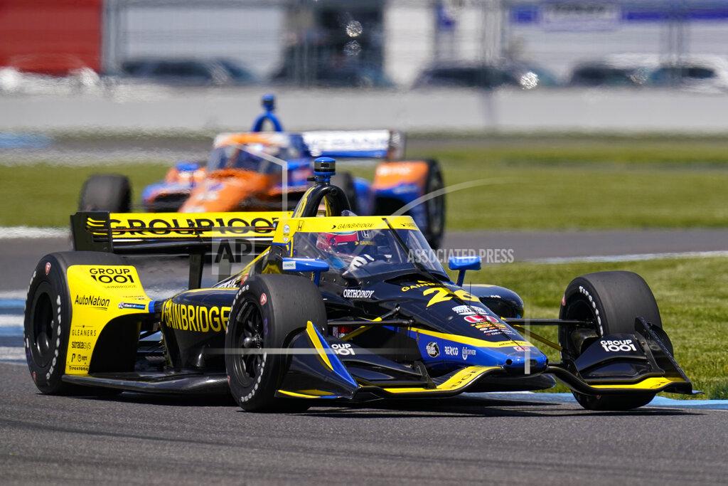 Michael Conroy Colton Herta drives through a turn during practice for the IndyCar auto race at Indianapolis Motor Speedway in Indianapolis, Friday, May 14, 2021. (AP Photo/Michael Conroy)