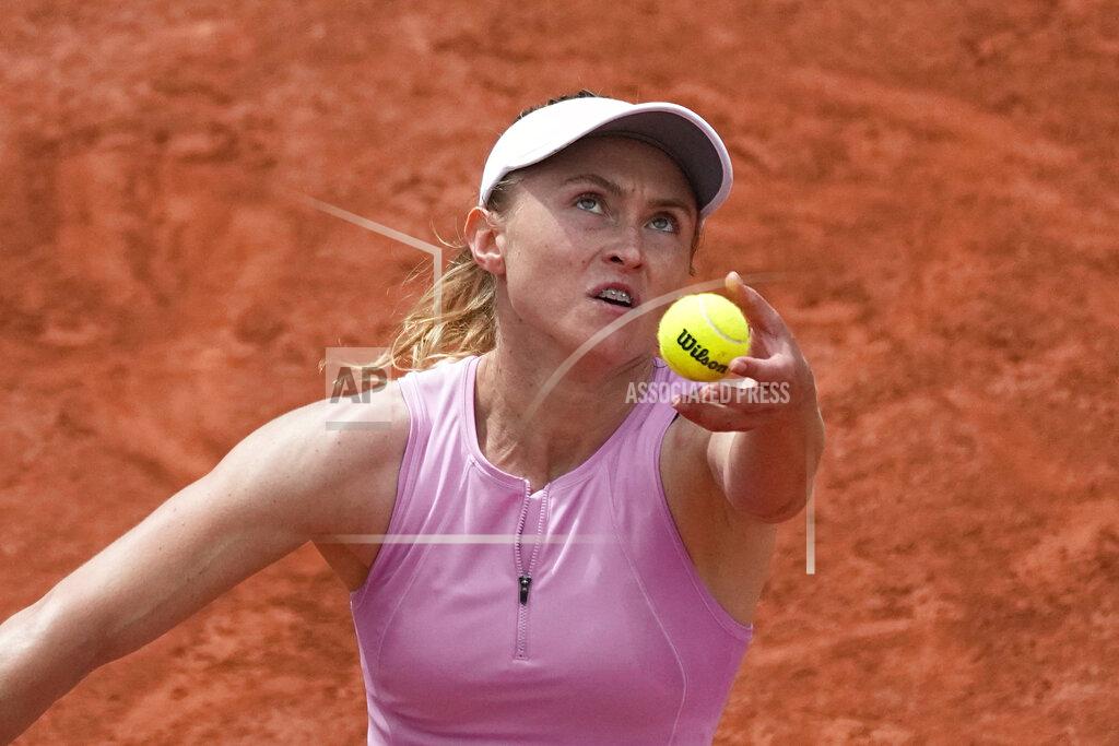 Michel Euler Aliaksandra Sasnovich of Belarus serves the ball to Germany's Angelique Kerber during their third round match of the French Open tennis tournament at the Roland Garros stadium Friday, May 27, 2022 in Paris. (AP Photo/Michel Euler)