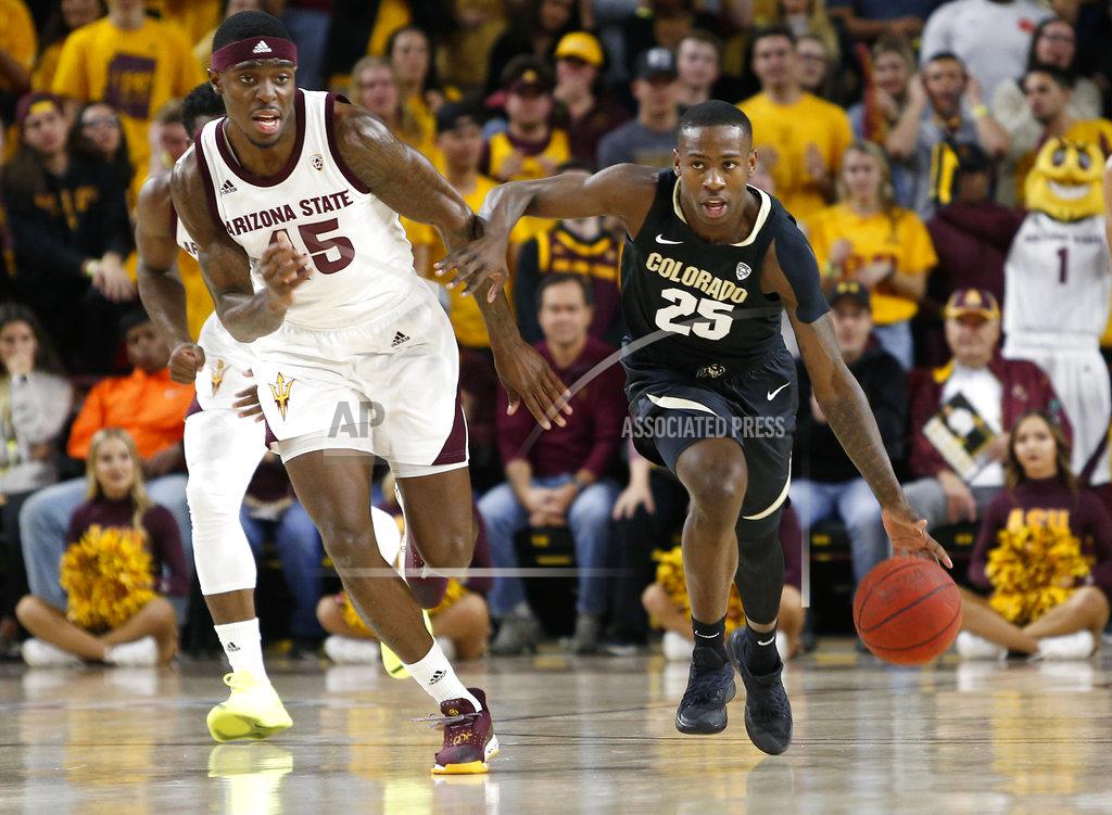 Colorado guard McKinley Wright (25) advances the ball up the court past Arizona State's Zylan Cheatman during the first half of an NCAA college basketball game, Saturday, Jan. 5, 2019, in Tempe, Ariz. (AP Photo/Ralph Freso)
