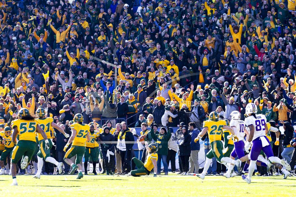 FILE - In this Jan. 11, 2020, file photo, North Dakota State safety James Hendricks (6) slides on the field after intercepting a pass from James Madison quarterback Ben DiNucci during the the second half of the FCS championship NCAA college football game in Frisco, Texas. As the college football season ramps up in three major conferences and among other programs scattered across the country, there will be a void at the Football Championship Subdivision level -- very few games and no scheduled playoffs. (AP Photo/Sam Hodde, File)