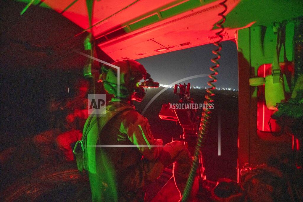 Uncredited French Barkhane force helicopter lands at its base in Gao, Mali, Monday June 7, 2021, following a night mission. France suspended joint military operations with Malian forces after the junta led by Col. Assimi Goita retook control of Mali's transitional government May 24 2021, French President Emmanuel Macron announced at a press conference Thursday June 10, 2021 That operation Barkhane would end and be replaced by support for local partners and counter terrorism. (AP Photo/Jerome Delay)