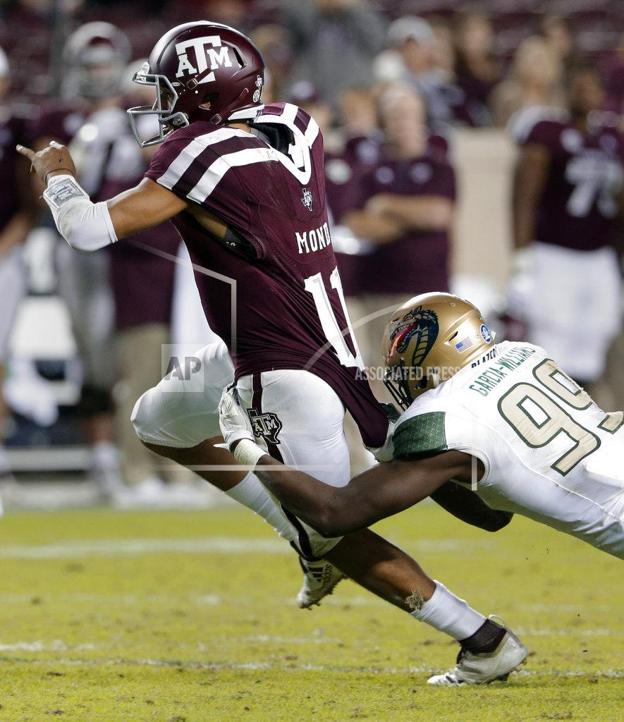Michael Wyke Texas A&M quarterback Kellen Mond (11) is caught on a keeper play by UAB defensive lineman Jamell Garcia-Williams (99) during the second half of an NCAA college football game Saturday, Nov. 17, 2018, in College Station, Texas. (AP Photo/Michael Wyke)