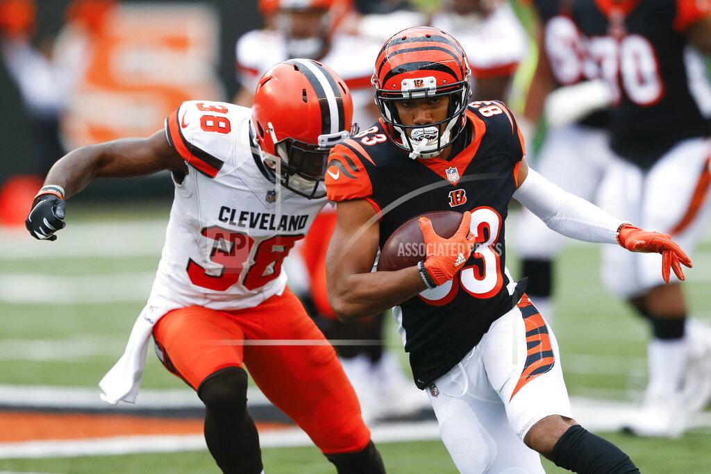 Gary Landers FILE - In this Sunday, Nov. 25, 2018 file photo, Cincinnati Bengals wide receiver Tyler Boyd (83) runs the ball against Cleveland Browns defensive back T.J. Carrie (38) in the second half of an NFL football game in Cincinnati. Receiver Tyler Boyd signed a four-year contract extension on Tuesday, July 23, 2019 coming off his breakthrough season with the Cincinnati Bengals.(AP Photo/Gary Landers, File)