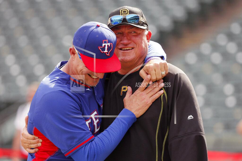 Tony Gutierrez FILE - In this May 27, 2016, file photo, Texas Rangers manager Jeff Banister, left, and Pittsburgh Pirates manager Clint Hurdle greet each other during batting practice before a baseball game in Arlington, Texas. Hurdle began sending his daily notes of inspiration more than 10 years ago, during his days managing the Colorado Rockies. They were a simple, small way of checking in with everybody on his staff to discuss leadership ideas or offer support. (AP Photo/Tony Gutierrez, File)