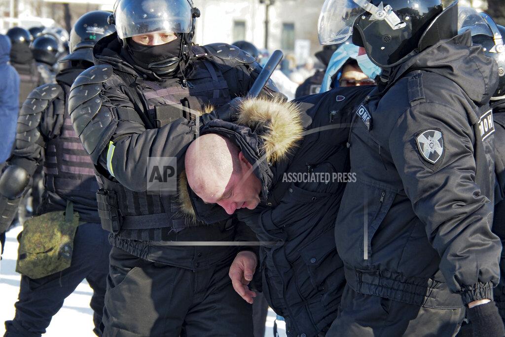 Igor Volkov Police detain a man during a protest against the jailing of opposition leader Alexei Navalny in Khabarovsk, 6,100 kilometers (3,800 miles) east of Moscow, Russia, Saturday, Jan. 23, 2021. Authorities in Russia have taken measures to curb protests planned for Saturday against the jailing of Navalny. (AP Photo/Igor Volkov)