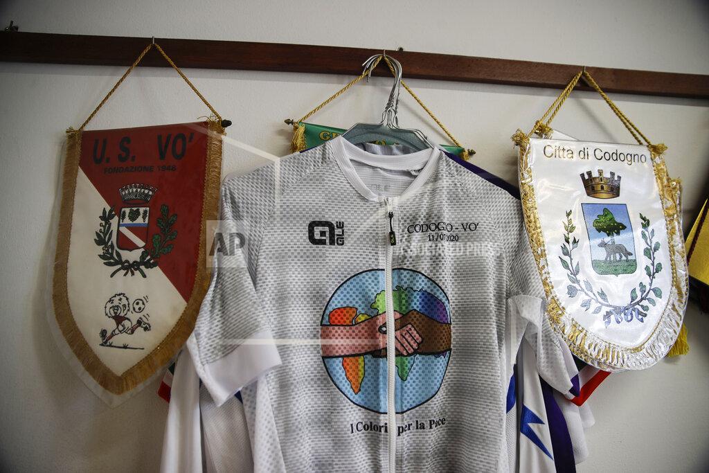 Luca Bruno Soccer pennants of Vo Euganeo and Codogno hang inside the Vo Euganeo mayor town hall office, in Vo Euganeo, northern Italy, Wednesday, Feb. 10, 2021. Shockwaves ran through the wine-making village of Vo', west of Venice, as word spread last Feb. 21 that a retired roofer had died of the new coronavirus becoming the first known COVID-19 victim in the West. (AP Photo/Luca Bruno)