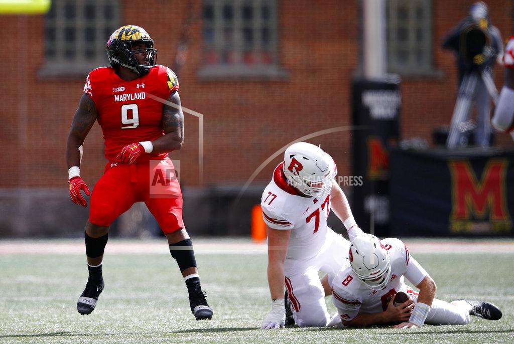 Patrick Semansky Maryland defensive lineman Byron Cowart, left, reacts after sacking Rutgers quarterback Artur Sitkowski (8) in the first half of an NCAA college football game, Saturday, Oct. 13, 2018, in College Park, Md. Also pictured is Rutgers offensive lineman Sam Vretman (77). (AP Photo/Patrick Semansky)