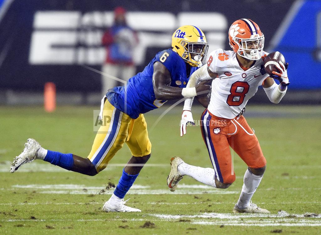 Mike Mccarn Clemson's A.J. Terrell (8) returns an interception against Pittsburgh's Aaron Mathews (6) in the first half of the Atlantic Coast Conference championship NCAA college football game in Charlotte, N.C., Saturday, Dec. 1, 2018. (AP Photo/Mike McCarn)
