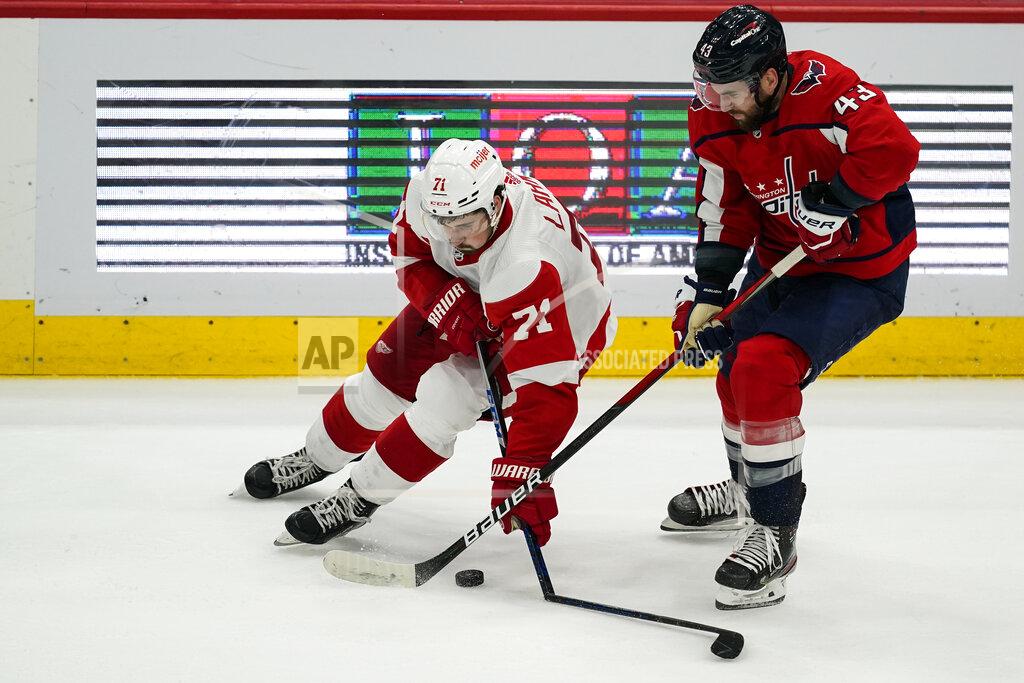 Alex Brandon Detroit Red Wings center Dylan Larkin (71) breaks his stick with Washington Capitals right wing Tom Wilson (43) nearby in the third period of an NHL hockey game, Wednesday, Oct. 27, 2021, in Washington. The Red Wings won 3-2 in overtime. (AP Photo/Alex Brandon)