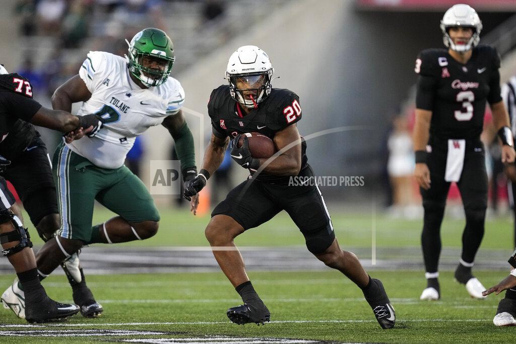 Brett Coomer Houston running back Brandon Campbell (20) runs the ball against Tulane during the second quarter of an NCAA college football game Friday, Sept. 30, 2022, in Houston. (Brett Coomer/Houston Chronicle via AP)