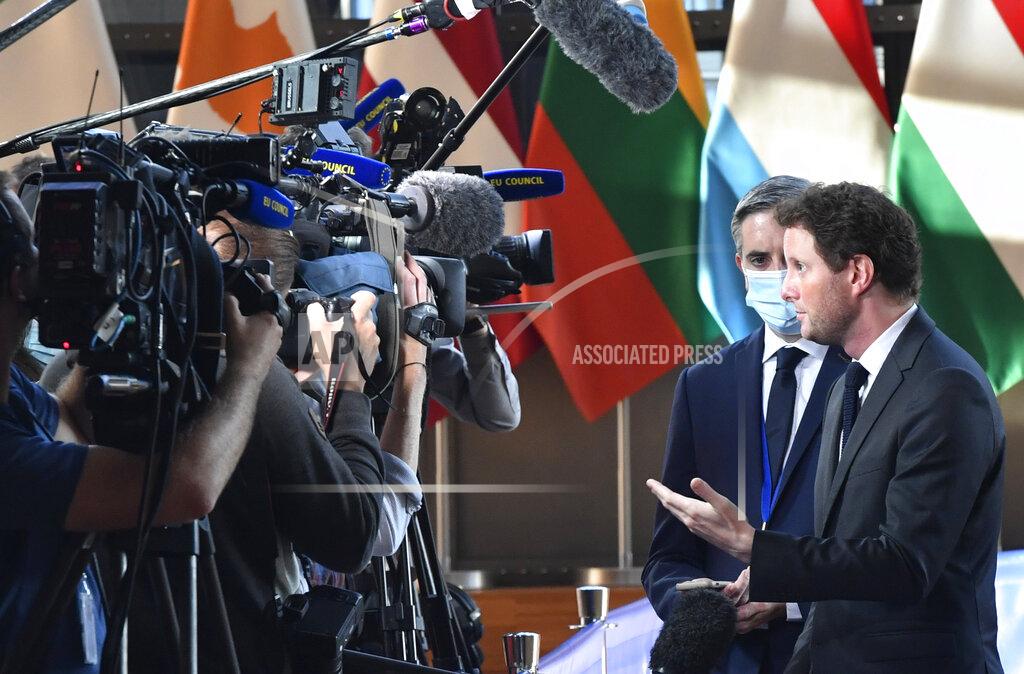 Geert Vanden Wijngaert France's European Affairs Minister Clement Beune, right, speaks with the media as he arrives for a meeting of EU General Affairs ministers at the European Council building in Brussels, Tuesday, Sept. 21, 2021. European Union General Affairs ministers meet Tuesday to discuss the state of play in UK-EU relations and a submarine deal between the U.S., Britain and Australia, which led to France losing a contract to sell subs to Australia. (AP Photo/Geert Vanden Wijngaert)