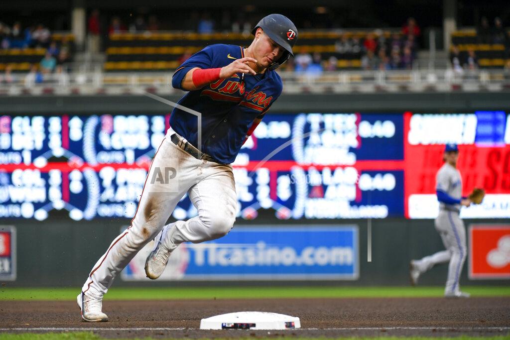 Craig Lassig Minnesota Twins' Jose Miranda rounds third base as he heads home to score on a single by Gilberto Celestino off Kansas City Royals pitcher Daniel Lynch during the fourth inning of a baseball game Thursday, May 26, 2022, in Minneapolis. (AP Photo/Craig Lassig)