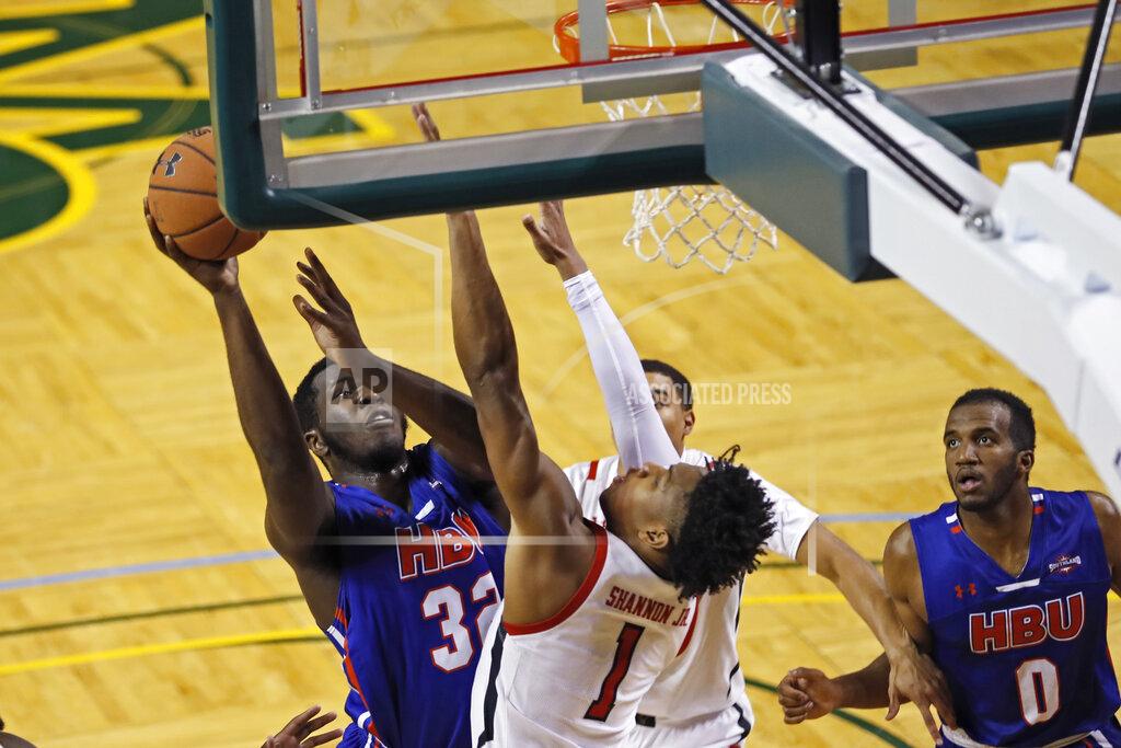 Brad Tollefson Houston Baptist's Benjamin Uloko (32) shoots over Texas Tech's Terrence Shannon Jr. (1) during the first half of an NCAA college basketball game Wednesday, Nov. 13, 2019, in Midland, Texas. [Brad Tollefson/Lubbock Avalanche-Journal via AP)