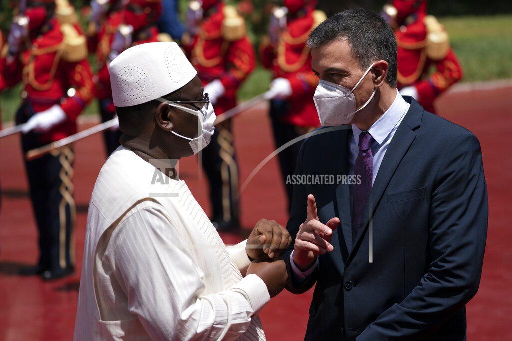 Leo Correa Senegal's President Macky Sall, left, welcomes Spanish Prime Minister Pedro Sanchez prior to a meeting at the presidential palace in Dakar, Senegal, Friday, April 9, 2021. Sanchez is on a mini-tour to Angola and Senegal that are key in the European country's new push to bolster ties with the neighboring continent and mitigate the migration flows that many fear could increase as a consequence of the coronavirus pandemic. (AP Photo/Leo Correa)
