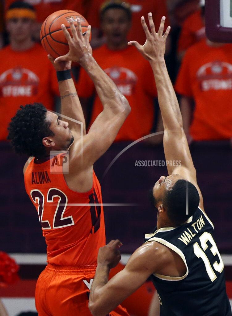 Matt Gentry Virginia Tech's Keve Aluma (22) scores over Dallas Walton (13) of Wake Forest in the first half of an NCAA college basketball game in Blacksburg, Va. Saturday, Dec. 4 2021. (Matt Gentry/The Roanoke Times via AP)