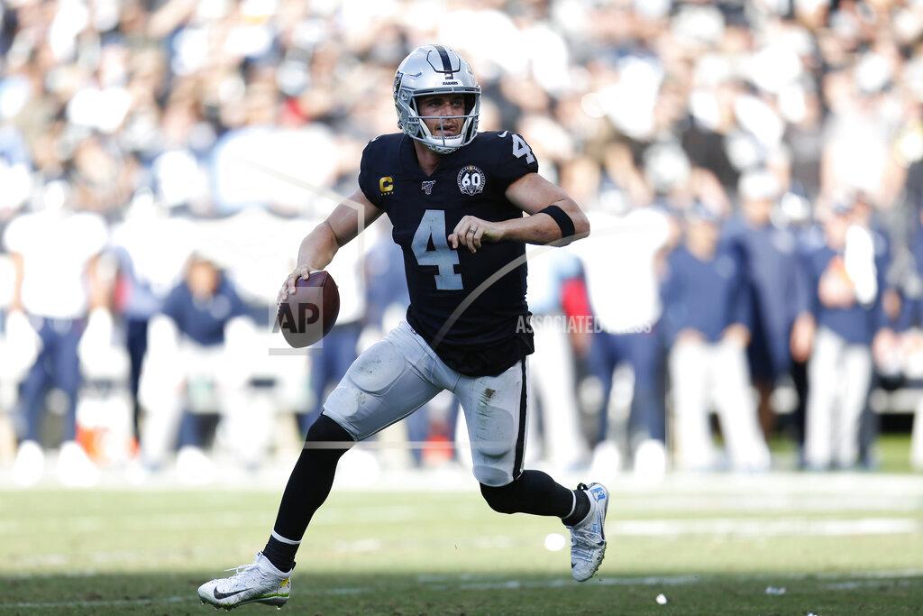 D. Ross Cameron Oakland Raiders quarterback Derek Carr (4) rolls out to pass against the Tennessee Titans during the first half of an NFL football game in Oakland, Calif., Sunday, Dec. 8, 2019. (AP Photo/D. Ross Cameron)