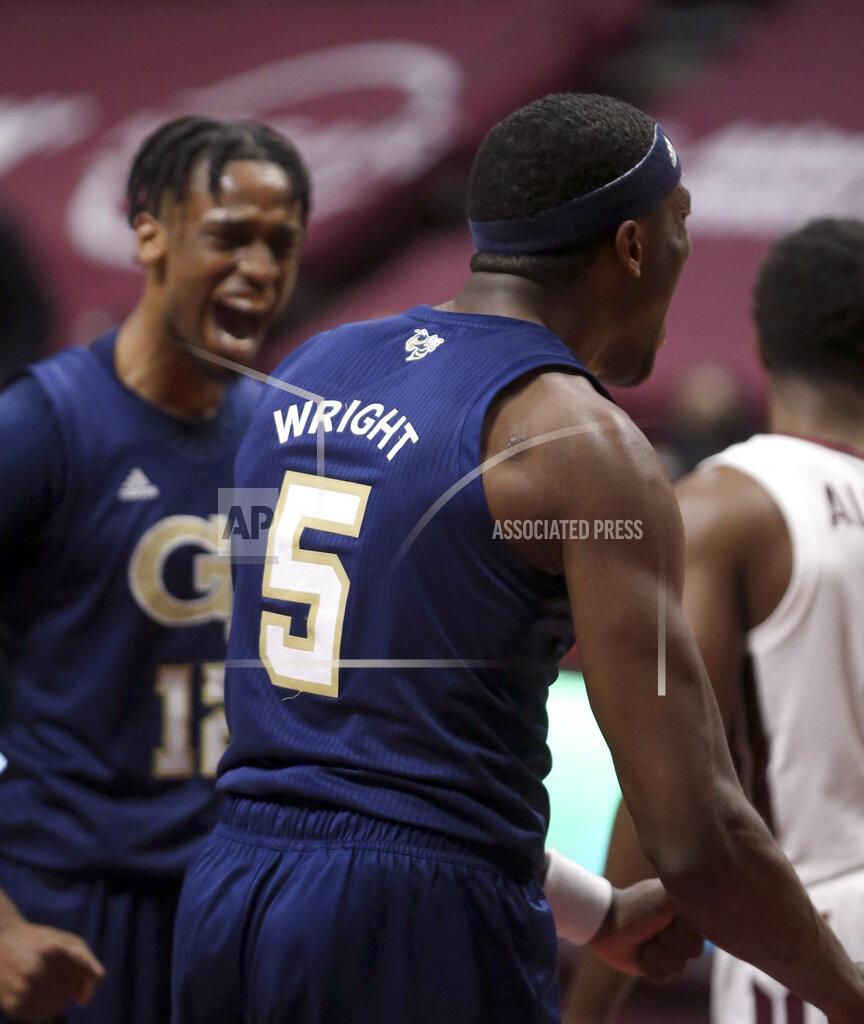 Matt Gentry Georgia Tech's Moses Wright (5) and Khalid Moore (12) celebrate a score during the second half of an NCAA college basketball game against Virginia Tech Tuesday, Feb. 23, 2021, in Blacksburg, Va. (Matt Gentry/The Roanoke Times via AP, Pool)