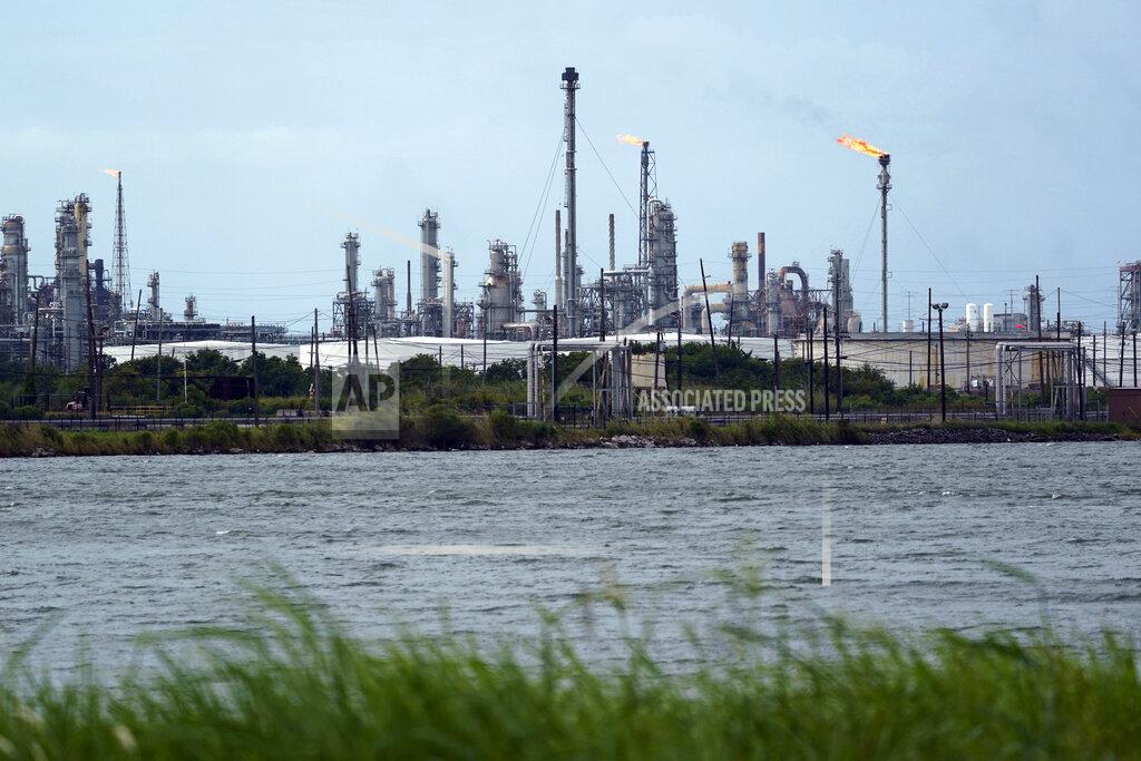 Eric Gay A refinery is seen along the water, Wednesday, Aug. 26, 2020, in Port Arthur, Texas. The energy industry is bracing for catastrophic storm surges and winds as Hurricane Laura cuts a dangerous path toward the coastlines of Texas and Louisiana.(AP Photo/Eric Gay)