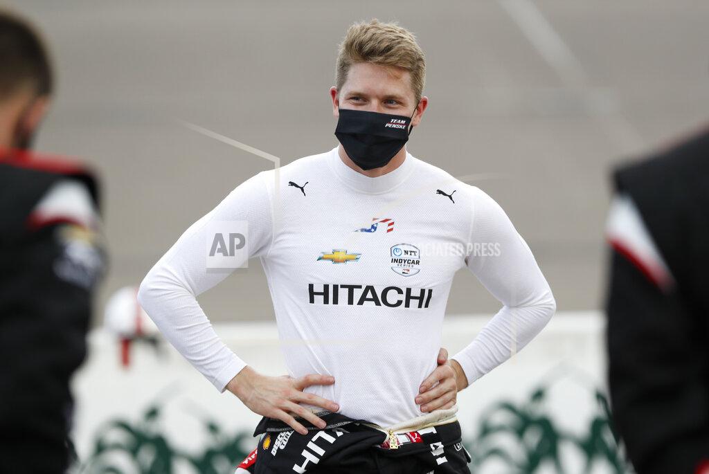 Charlie Neibergall Josef Newgarden talks with crew members before the start of the IndyCar Series auto race, Saturday, July 18, 2020, at Iowa Speedway in Newton, Iowa. (AP Photo/Charlie Neibergall)