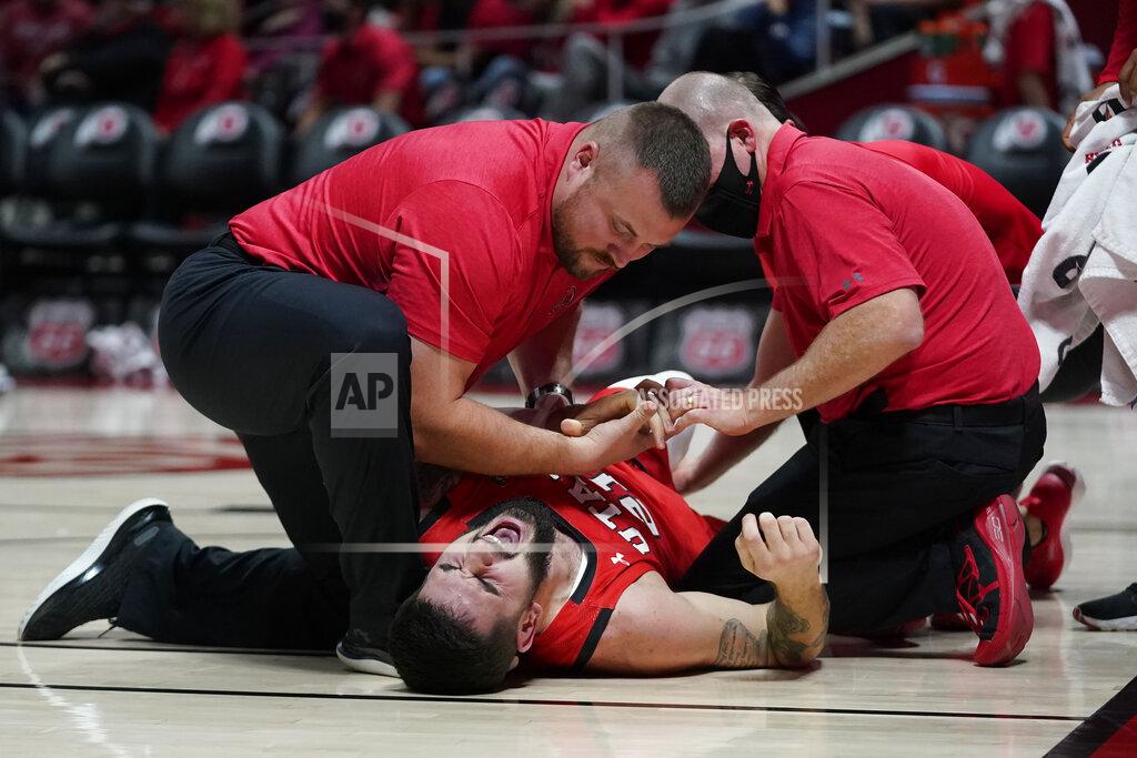 Rick Bowmer Utah forward Dusan Mahorcic (21) shouts after falling to the floor in the first half during an NCAA college basketball game against BYU Saturday, Nov. 27, 2021, in Salt Lake City. (AP Photo/Rick Bowmer)