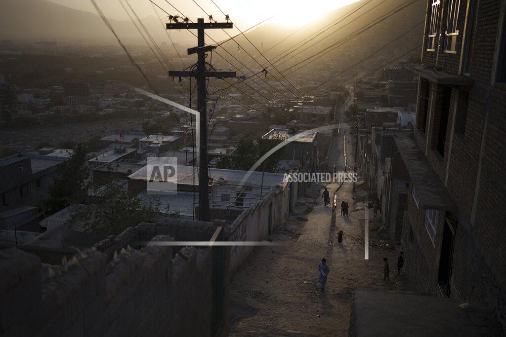 Felipe Dana People walk through an alleyway as the sun sets in Kabul, Afghanistan, Thursday, Sept. 16, 2021. (AP Photo/Felipe Dana)
