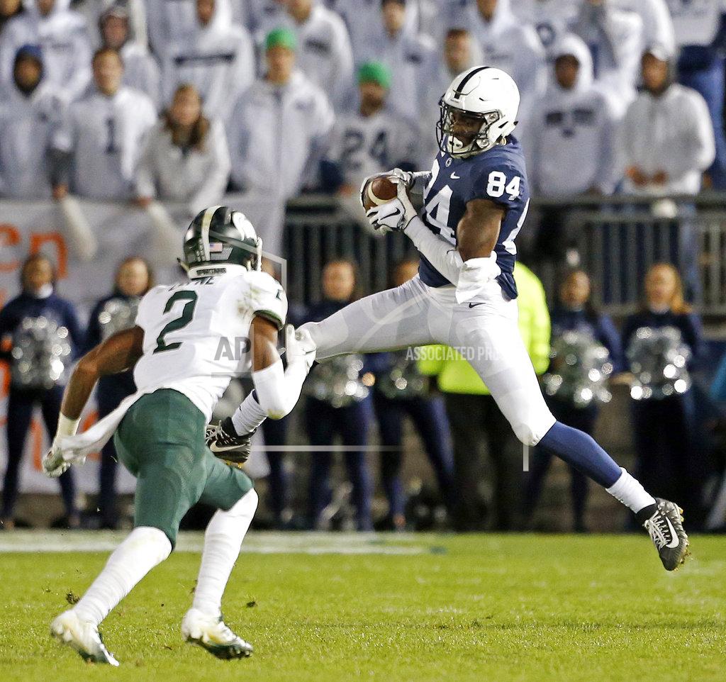 Chris Knight Penn State's Juwan Johnson (84) catches a pass in front of Michigan State's Justin Layne (2) during the second half of an NCAA college football game in State College, Pa., Saturday, Oct. 13, 2018. (AP Photo/Chris Knight)