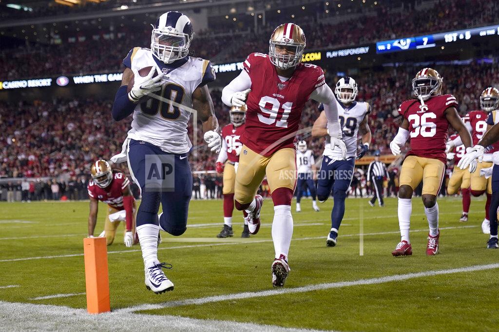 Los Angeles Rams running back Todd Gurley II (30) runs for a touchdown against the San Francisco 49ers during the first half of an NFL football game in Santa Clara, Calif., Saturday, Dec. 21, 2019. (AP Photo/Tony Avelar)