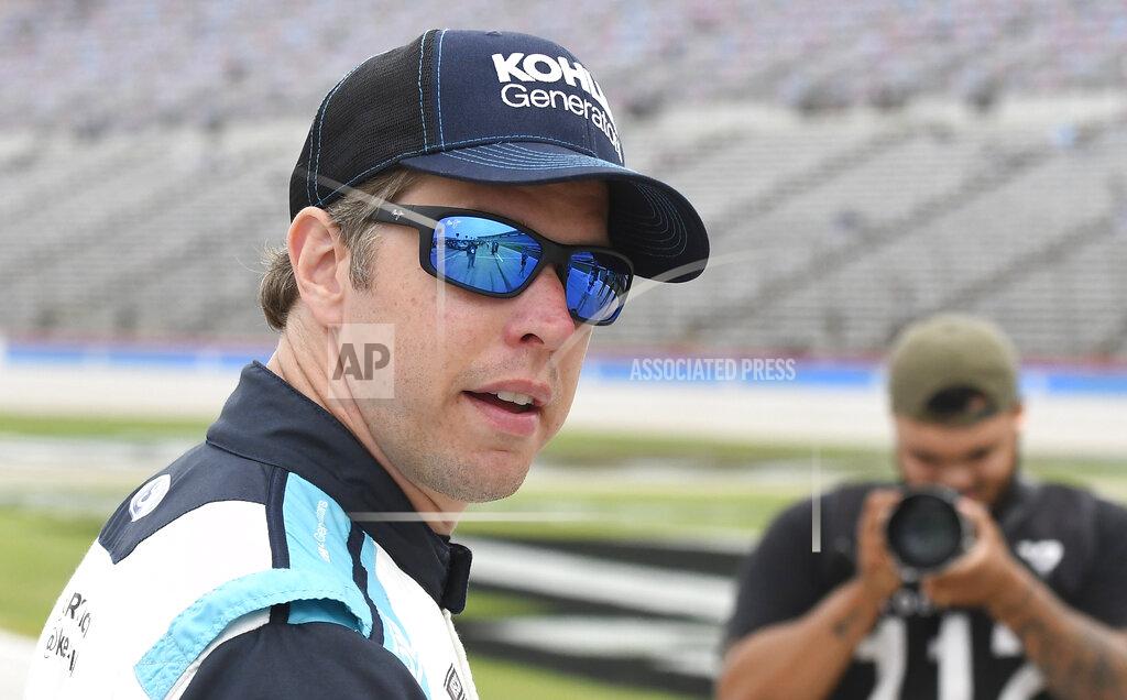 Randy Holt Brad Keselowski (6) stands in pit row before qualifying for the NASCAR All-Star auto race at Texas Motor Speedway in Fort Worth, Texas, Saturday, May 21, 2022. (AP Photo/Randy Holt)