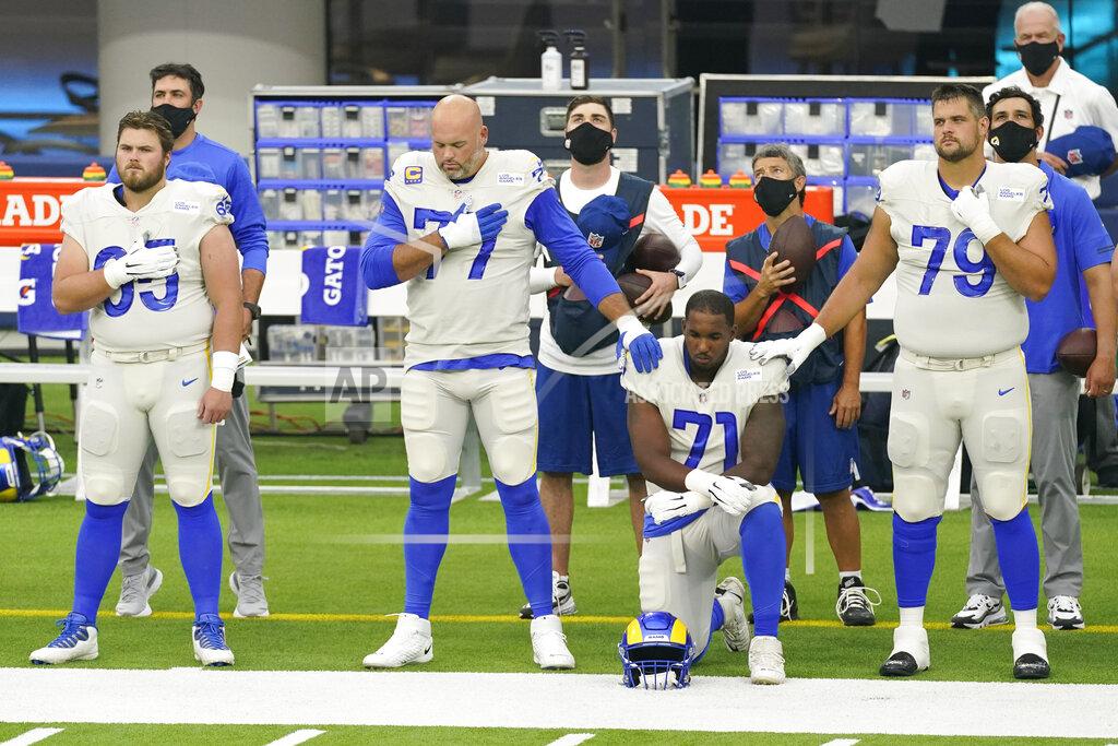 Ashley Landis Members of the Los Angeles Rams stand and kneel during the national anthem before an NFL football game against the Dallas Cowboys Sunday, Sept. 13, 2020, in Inglewood, Calif. (AP Photo/Ashley Landis)