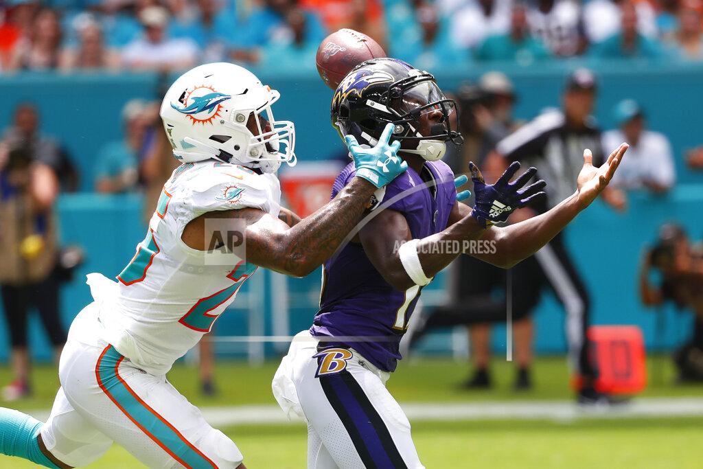 Wilfredo Lee Miami Dolphins cornerback Xavien Howard (25) attempts to catch intended for Baltimore Ravens wide receiver Marquise Brown (15), during the first half at an NFL football game, Sunday, Sept. 8, 2019, in Miami Gardens, Fla. (AP Photo/Wilfredo Lee)