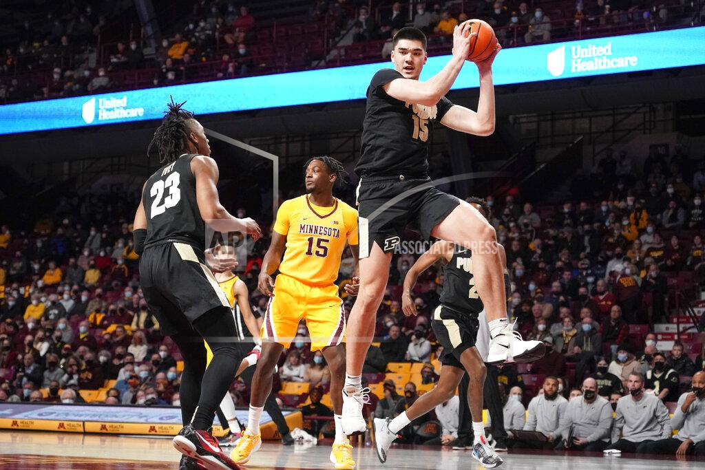 Craig Lassig Purdue center Zach Edey, right, grabs a rebound near Purdue guard Jaden Ivey, left, and Minnesota forward Charlie Daniels (15) during the first half an NCAA college basketball game Wednesday Feb. 2, 2022, in Minneapolis. (AP Photo/Craig Lassig)