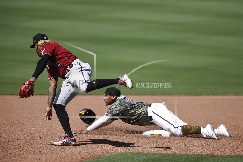 Kelvin Kuo San Diego Padres' Josh Naylor, bottom, slides past second base on a steal attempt next to Arizona Diamondbacks second baseman Ketel Marte during the seventh inning of a baseball game in San Diego, Sunday, July 26, 2020. Naylor was out. (AP Photo/Kelvin Kuo)
