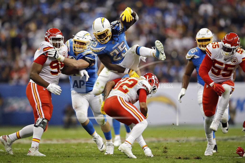 Marcio Jose Sanchez Los Angeles Chargers running back Melvin Gordon, above, leaps over Kansas City Chiefs strong safety Tyrann Mathieu during the first half of an NFL football game Monday, Nov. 18, 2019, in Mexico City. (AP Photo/Marcio Jose Sanchez)