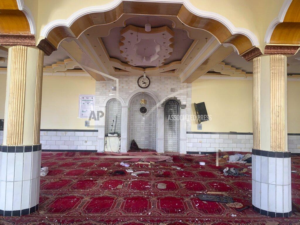 Rahmat Gul Debris covers the ground at a mosque after a bomb explosion in Shakar Dara district of Kabul, Afghanistan, Friday, May 14, 2021. A bomb ripped through a mosque in northern Kabul during Friday prayers killing 12 worshippers, Afghan police said. (AP Photo/Rahmat Gul)