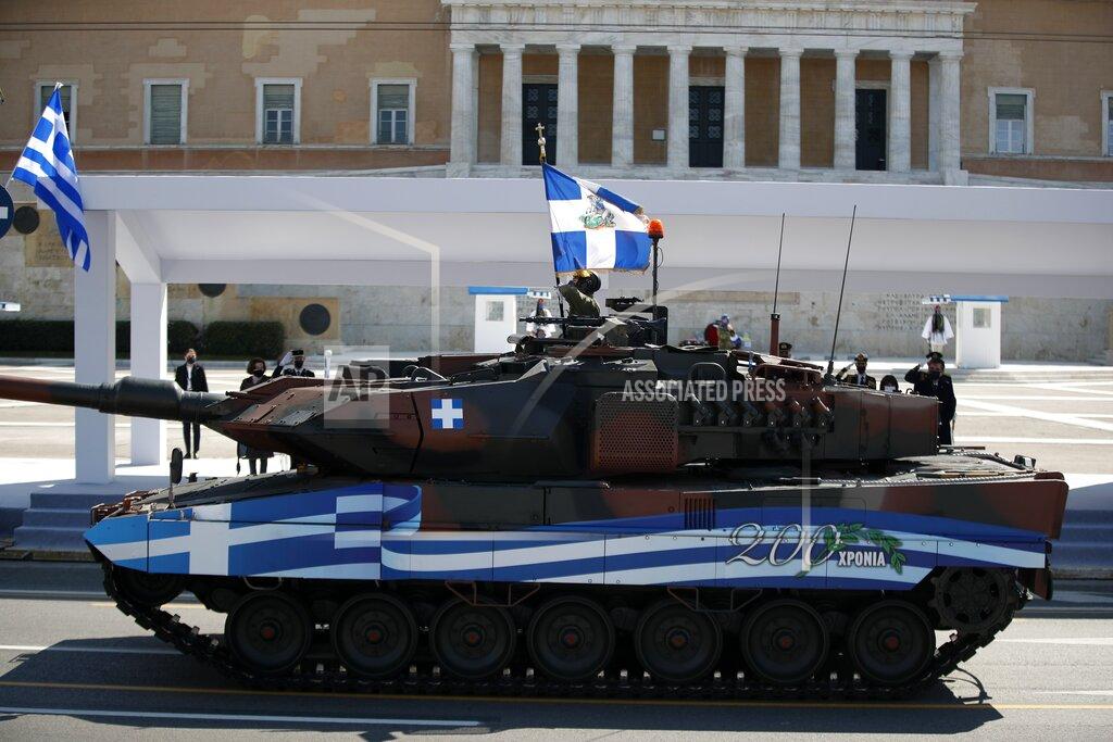 Thanassis Stavrakis Tanks are driven by members of the Greek Army during a military parade parade in front of the Greek Parliament in Athens, Thursday, March 25, 2021. Greece's celebrations for the bicentenary of the start of the nation's war of independence are culminating in a military parade and warplane flyby in Athens on Thursday, the country's Independence Day. (AP Photo/Thanassis Stavrakis)