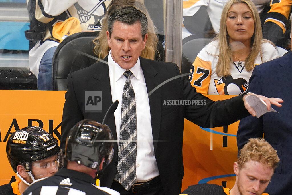 Gene J. Puskar Pittsburgh Penguins coach Mike Sullivan talks with official Kevin Pollock during the third period in Game 6 of the team's NHL hockey Stanley Cup first-round playoff series against the New York Rangers in Pittsburgh, Friday, May 13, 2022. The Rangers won 5-3. (AP Photo/Gene J. Puskar)