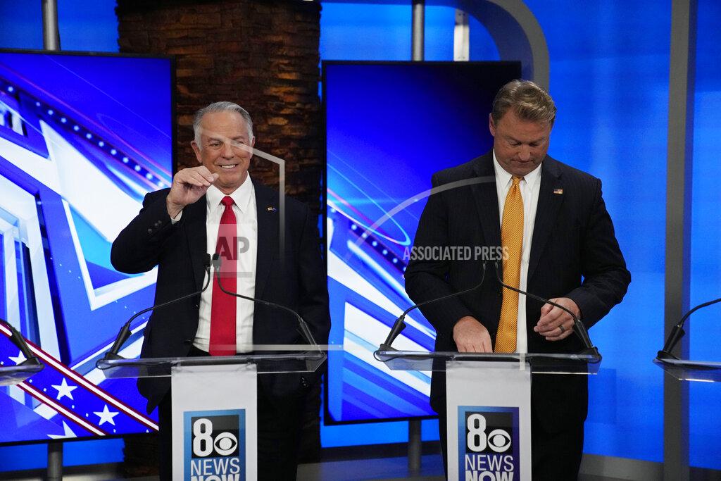 John Locher Clark County Sheriff Joe Lombardo, left, motions beside former U.S. Senator Dean Heller laugh before a Republican primary debate for Nevada governor Wednesday, May 25, 2022, in Las Vegas. (AP Photo/John Locher, Pool)