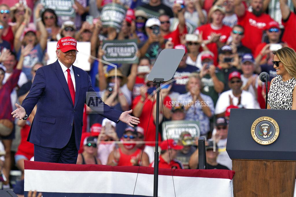 Chris O'meara President Donald Trump gestures as he is introduced by first lady Melania Trump during a campaign rally Thursday, Oct. 29, 2020, in Tampa, Fla. (AP Photo/Chris O'Meara)