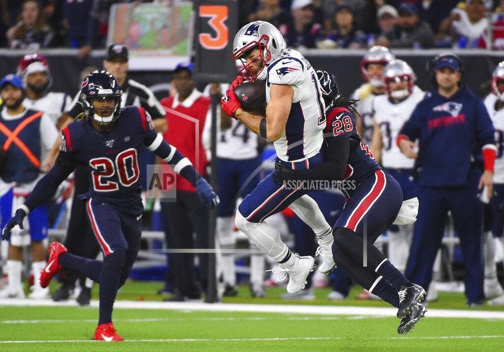 Eric Christian Smith New England Patriots wide receiver Julian Edelman (11) is hit by Houston Texans cornerback Vernon III Hargreaves (28) as he makes a catch during the first half of an NFL football game Sunday, Dec. 1, 2019, in Houston. (AP Photo/Eric Christian Smith)