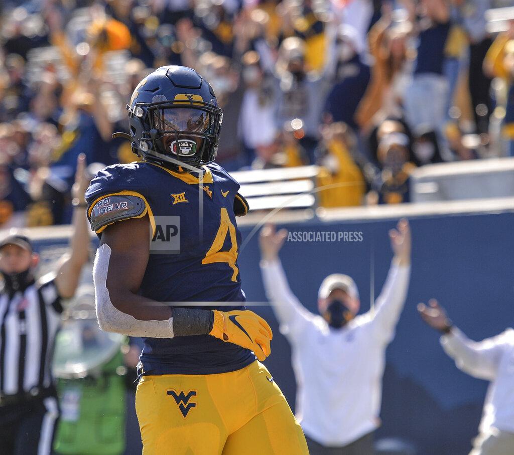 William Wotring West Virginia running back Leddie Brown (4) scores a touchdown against Kansas during an NCAA college football game, Saturday, Oct. 17, 2020, in Morgantown, W.Va. (William Wotring/The Dominion-Post via AP)
