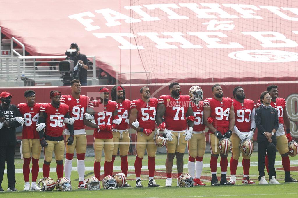 Josie Lepe San Francisco 49ers players and coaches stand during a presentation on social justice before an NFL football game against the Arizona Cardinals in Santa Clara, Calif., Sunday, Sept. 13, 2020. (AP Photo/Josie Lepe)