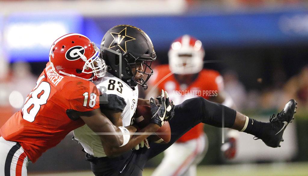 John Bazemore Georgia defensive back Deandre Baker (18) breaks up a pass intended for Vanderbilt wide receiver C.J. Bolar (83) during the first half of an NCAA college football game Saturday, Oct. 6, 2018, in Atlanta. (AP Photo/John Bazemore)