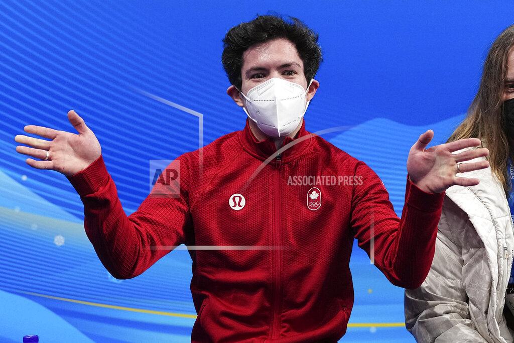 Keegan Messing, of Canada, reacts after the men's short program figure skating competition at the 2022 Winter Olympics, Tuesday, Feb. 8, 2022, in Beijing. (AP Photo/David J. Phillip)