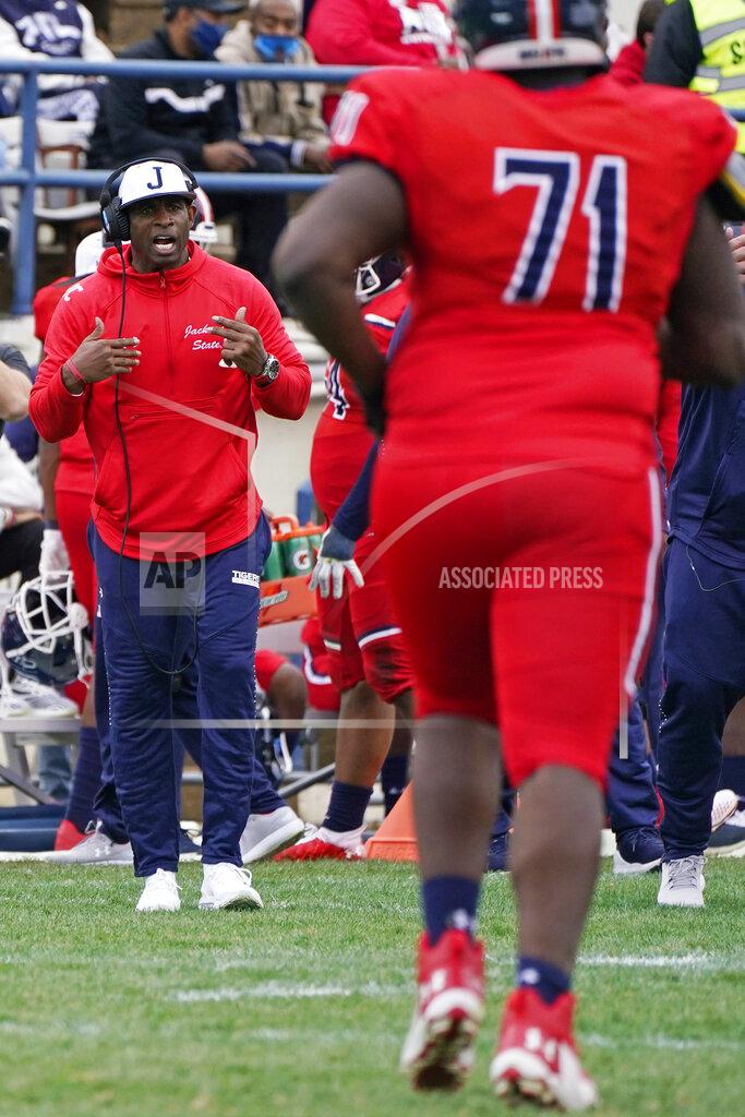 Rogelio V. Solis Jackson State head coach Deion Sanders calls out to his offense during the second half of an NCAA college football game against Edward Waters in Jackson, Miss., Sunday, Feb. 21, 2021. The game marked the coaching debut of Sanders. (AP Photo/Rogelio V. Solis)