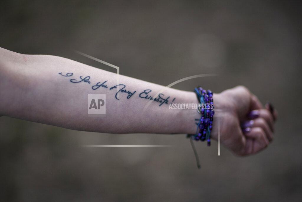 David Goldman Ashley Ellis, 34, shows a tattoo of a handwritten note from her fiancé, Brandon Williams, on her arm, Tuesday, March 16, 2021, in Huntington, W.Va. Ellis started using drugs in college and has tried many times to stop using. She met the love of her life, Williams, when they were both in recovery. "He had the most beautiful soul of anyone I've ever known," she said. But shortly after their child was born, they both relapsed. Williams died of an overdose. Now she's determined to remain in recovery. "I think losing Brandon has been, quite possibly, what's going to save my life." (AP Photo/David Goldman)